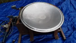 SS lid laying on top of chair lift.webp