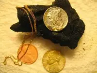 found old coins and gold chain copy.webp