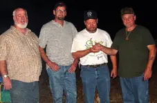 gold coin presentation to Bob.webp