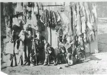 boys with furs dogs gunss.webp