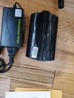 Fisher AQ pulse battery bottom with universal smart charger.webp