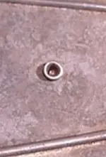 unk backside rivet or shaft.webp