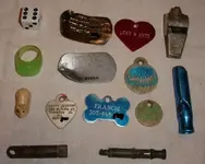 dog tags, whistles, plastic.webp