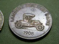 brass car coin.webp