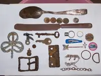 wheat pennies, silver dime, and various other finds.webp