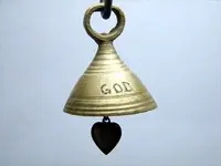 brass God bell with heart clapper.webp