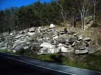 roadway rocks and trees.webp