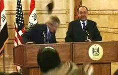 iraqi journalist throws shoes at Bush.webp