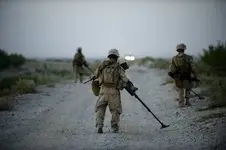 US Marines search for roadside bombs in Afghanistan Helmand province on July 13 2009.webp