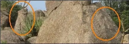 weathered face carvings.webp