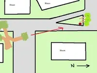 7-diagram of houses, streets and small park island with rock..webp