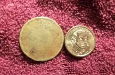 Ladys coin at dads work.webp