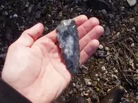 Archaic knife F sch. in-hand.webp