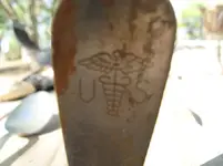 Fork with US and medical insignia.webp