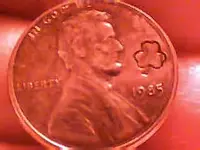 penny with clover stamped on it..webp