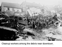 Cleanup-workers-in-debris.webp