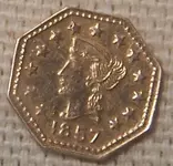 front_of_dad\'s_gold_coin.webp
