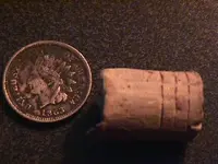 1863 Indian Head Cent and Rifled 58 Cal Bullet.webp
