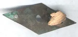 brass thingy with wood.webp