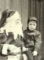 Unhappy Poster Boy with Santa.webp