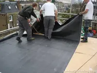 EPDM-flat-roof-fulham-laying-sheet.webp