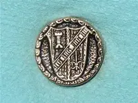 button shield with ruffle.webp