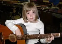 Little Musician at dinner.webp