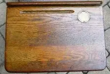 Antique_school_desk_with_ink_well.webp