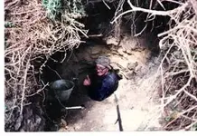 passing blown up cave entrance.webp