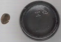 Bottle bottom and bent dime.webp