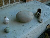 Grinding stone and sleigh bell.jpg