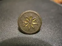 cuff button uncleaned.webp