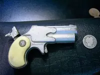 Toy Pistol with cocked hammer.webp