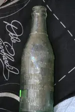 Coke bottle side view.webp