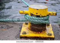 stock-photo-rope-tied-to-bollard-on-ship-dock-54849199.webp
