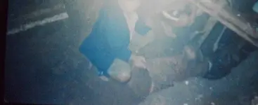me showing the bomb shell we\'ve excavated.webp