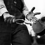 eric-schaal-country-music-close-up-of-spoons-being-played-by-man-in-overalls.webp
