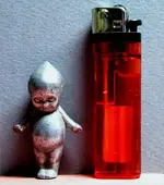 aluminum kewpie doll.webp