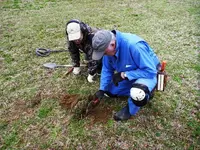 Gary R. & Earl H. digging and target in the front yard.webp