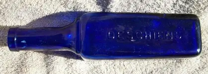 Deschiens Bottle Side One (700x251).webp