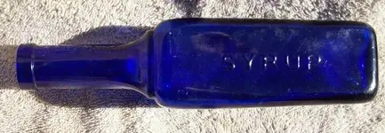 Deschiens Bottle Side Two with Syrup (700x243).webp