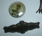 Husbandry Pin with Grange Plaque Close Up (1) (368x317) (368x317) (368x317).webp