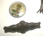 Husbandry Pin with Grange Plaque Close Up with color adjusted.webp