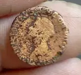 july 5th close up of weird old coin.webp