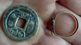 july 6th strange coin other side and ring.webp