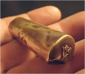 old brass lipstick tube.webp