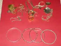 ARA Gold Filled pieces on top and Unknown silver bracelets at bottom.webp
