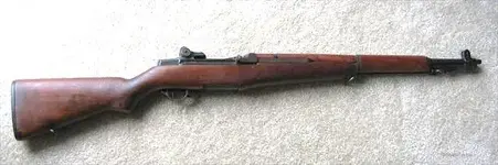 WW2_M1-Garand-Rifle_made-May1945_sideview_GunsAmerica.webp