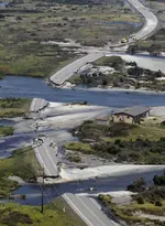Route 12 is broken in5 places on Hatteras Island, N.C. About 2,500 people stranded..webp