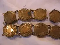 ladies-patriotic-belt_1880s-1910s_state-seals-Navy-and-eagles_closeup_backview_ebay_IMG_5709.webp